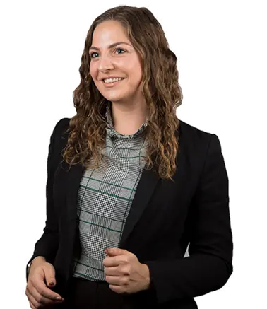 Student standing up smiling