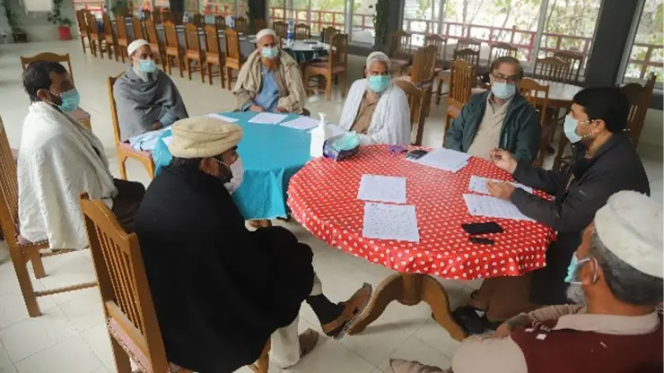 Mr. Zahir Shah (Program Director) and Mr. Rashid Mehdi (Distribution Manager) facilitating a focus group discussion with the farmers