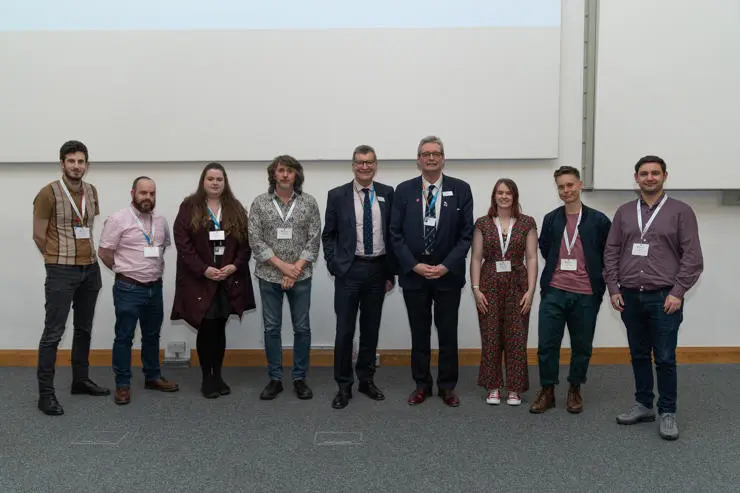 Left to right – Steven Gough-Kelly, Michael Haslam, Cheryl Underhill, Mark Mason, Graham Baldwin (Vice-Chancellor)  , StJohn Crean (Pro Vice-Chancellor Research and Enterprise) , Alexandra Bowers, Ellis Keller, David Hall.