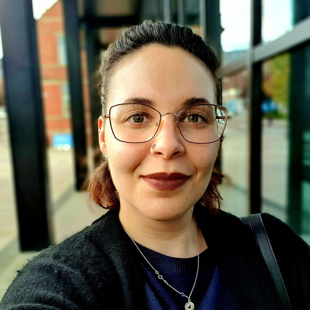 student selfie in front of the eic