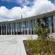 A picture of the student centre in the background with plants and flowers in the front