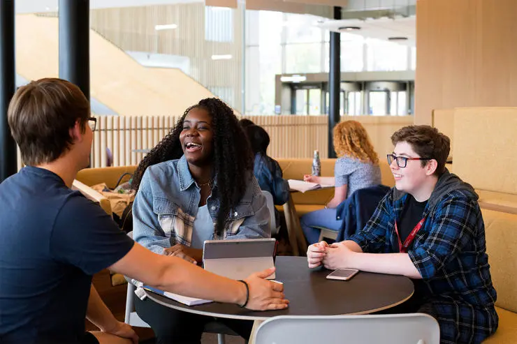 Students laughing in student centre