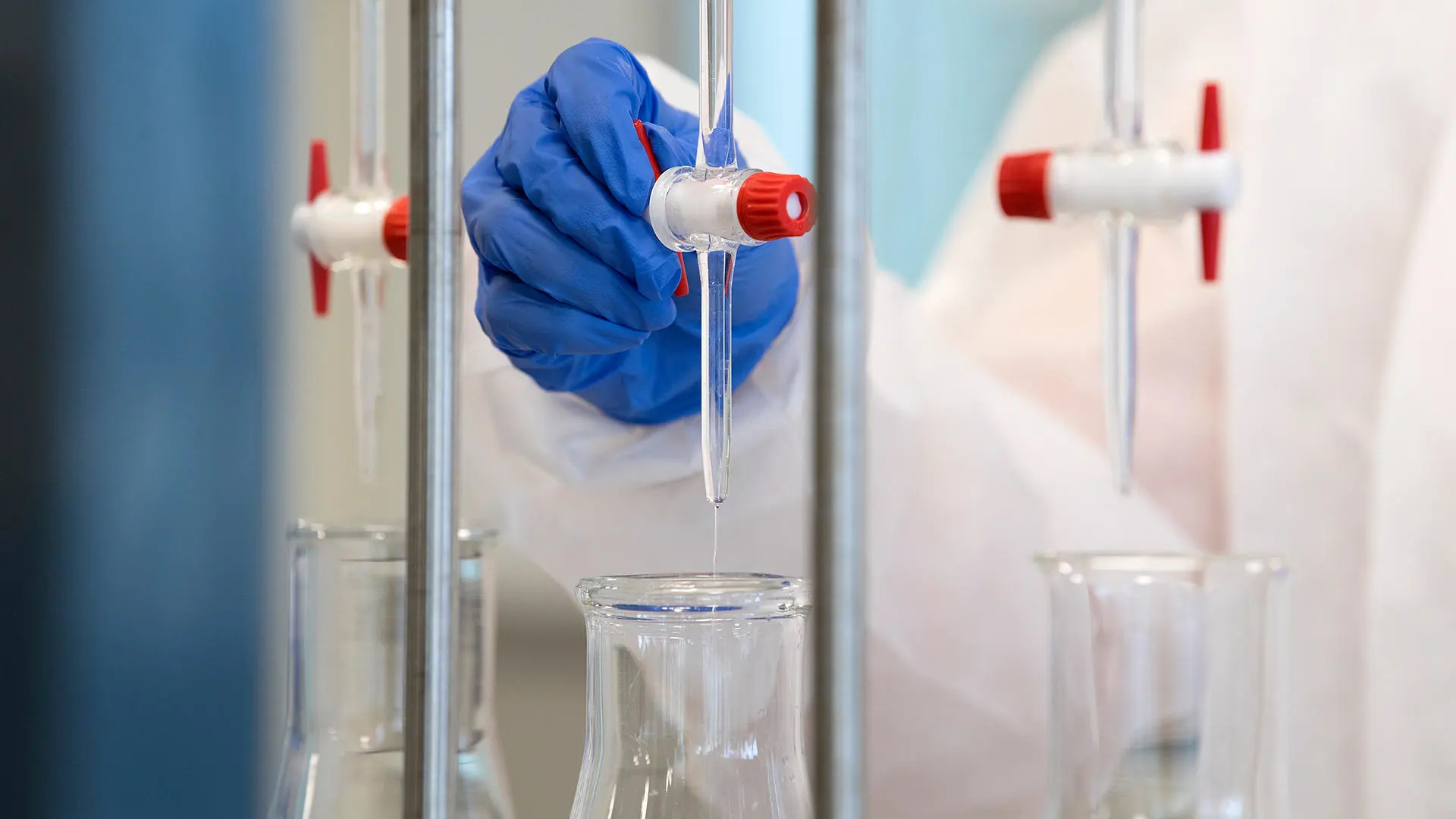 pharmacy student working in gloves and lab coat