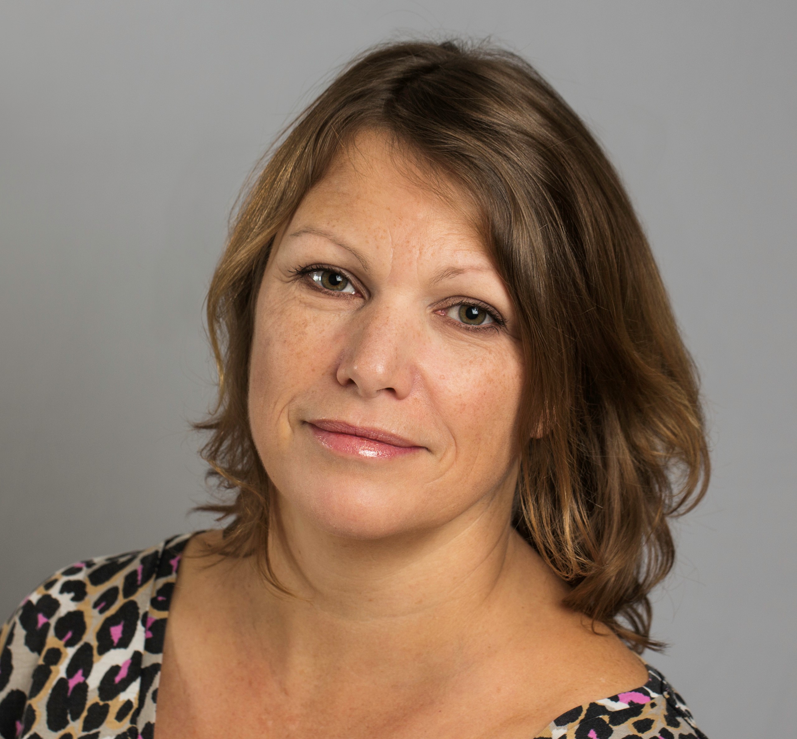 Kathy Webb in an animal print blouse