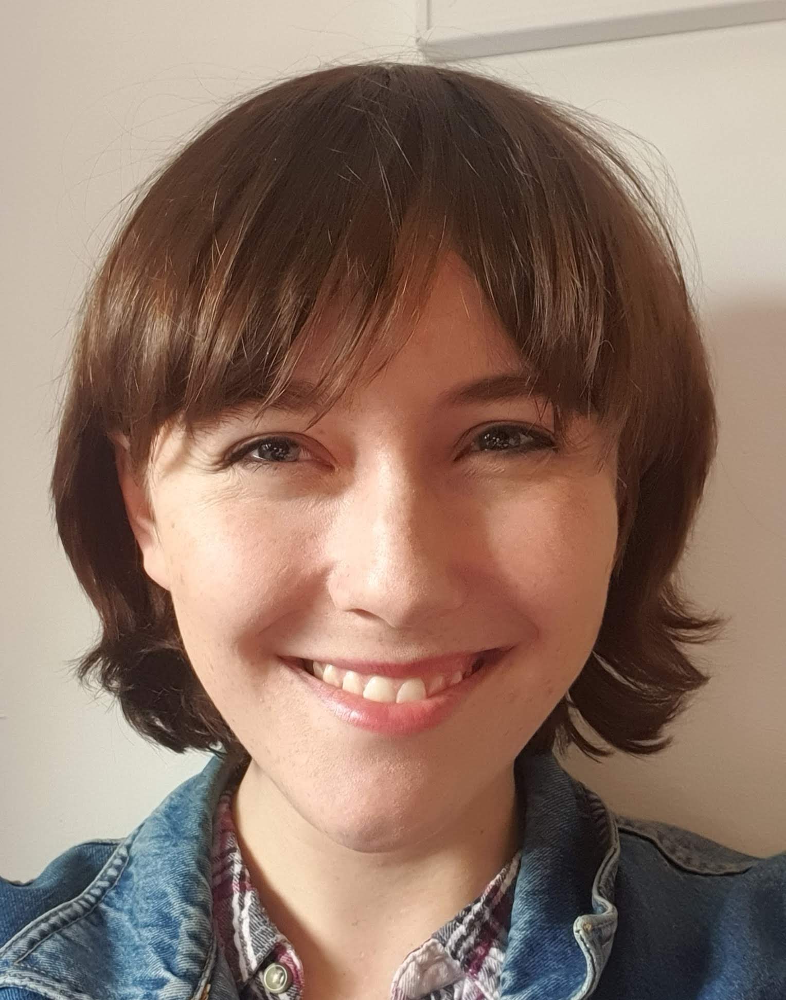 Megan Whitlock in a denim jacket