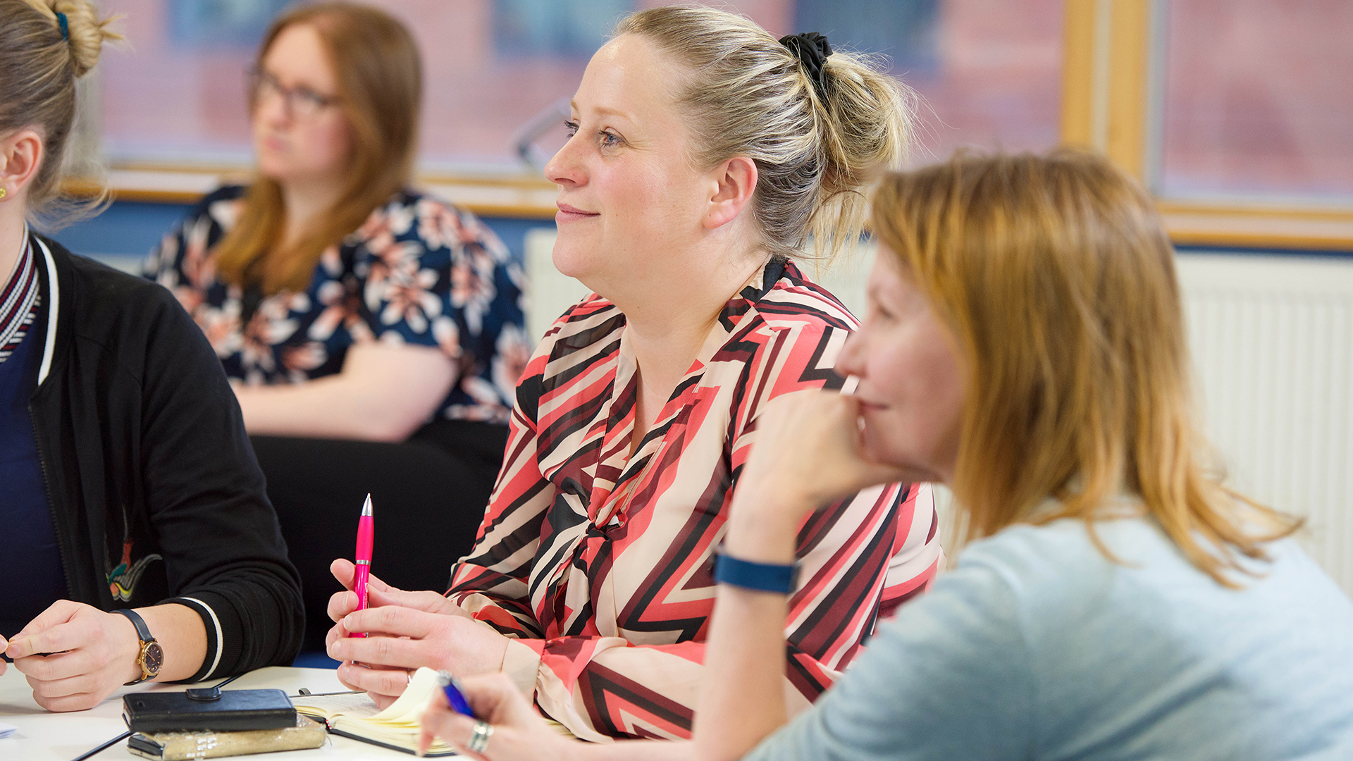 business management and Chinese students together listening