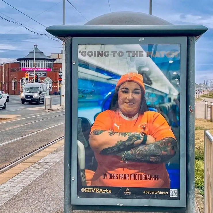 Going to the match photography by Debs Parr on a tram stop in Blackpool