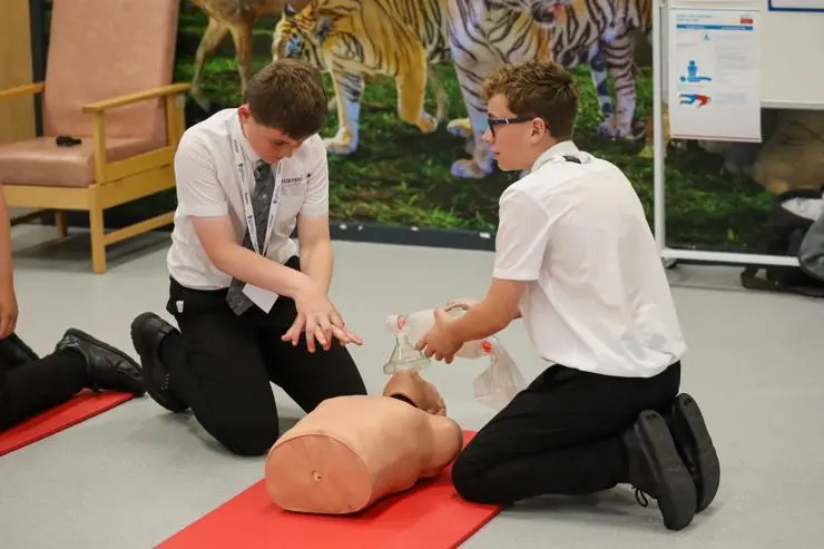Pupils getting hands on with CPR in the simulated children's ward.