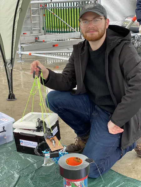 Jordan with the package of the high-altitude balloon sent into near space.