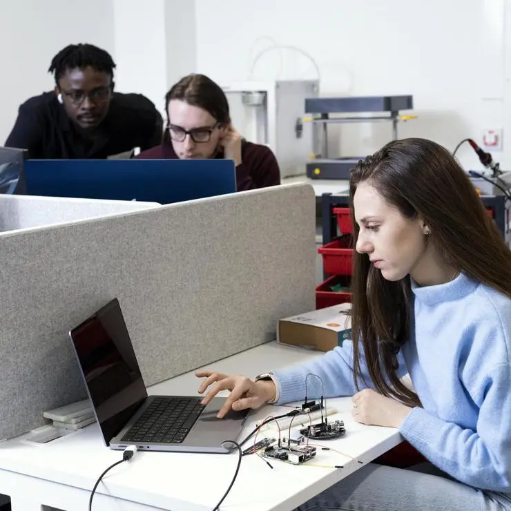 A group of students learning to programme physical computing.