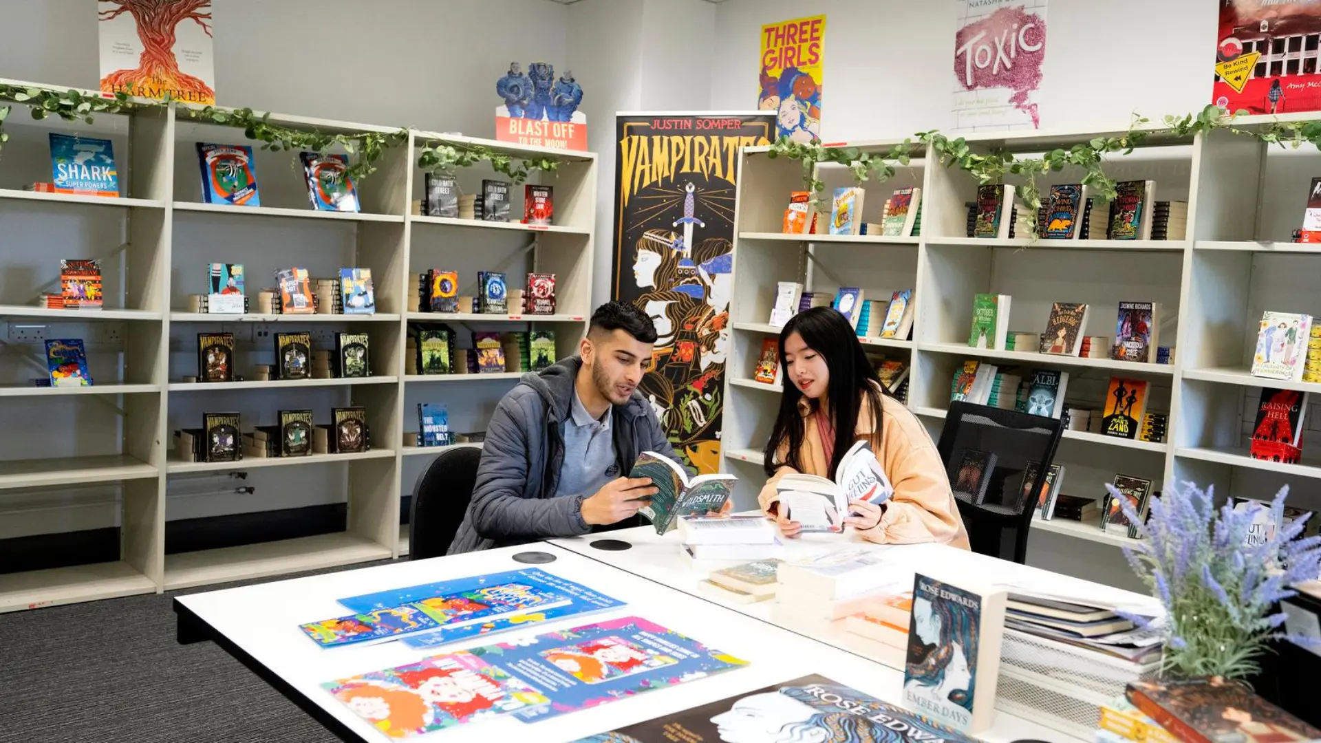 Two people in a bookshop