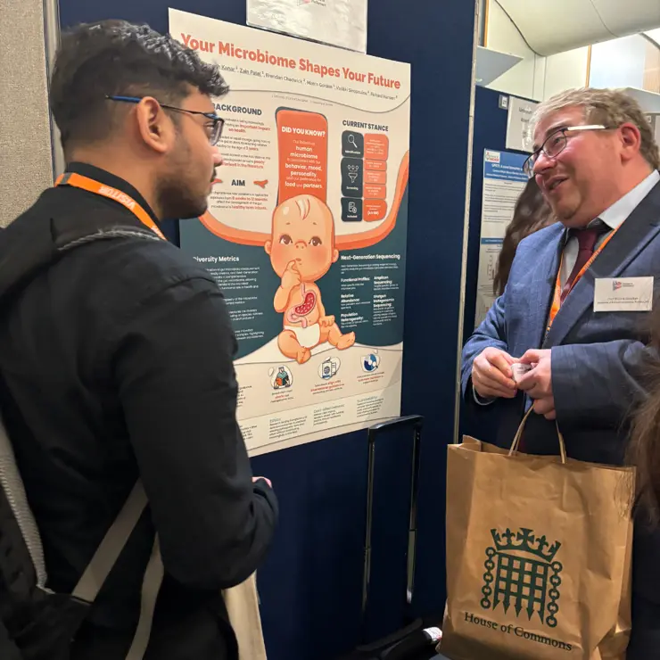 Aarav Kanar speaking to Professor Morris Gordon 
