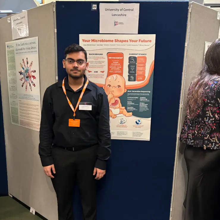 Aarav Kanar standing infront of his award-winning research poster