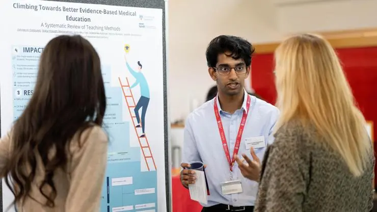 Student research intern Gokul presents infront of his research poster