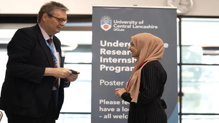 Winner Nunrunnahar Sultana receiving her prize from Professor StJohn Crean