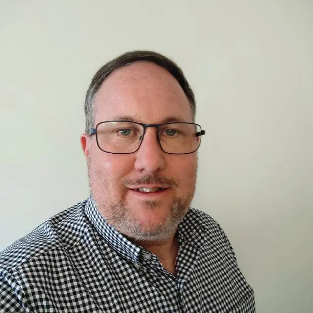 Headshot of Andrew Mason