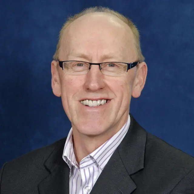 Headshot of Dr Mervyn Conroy