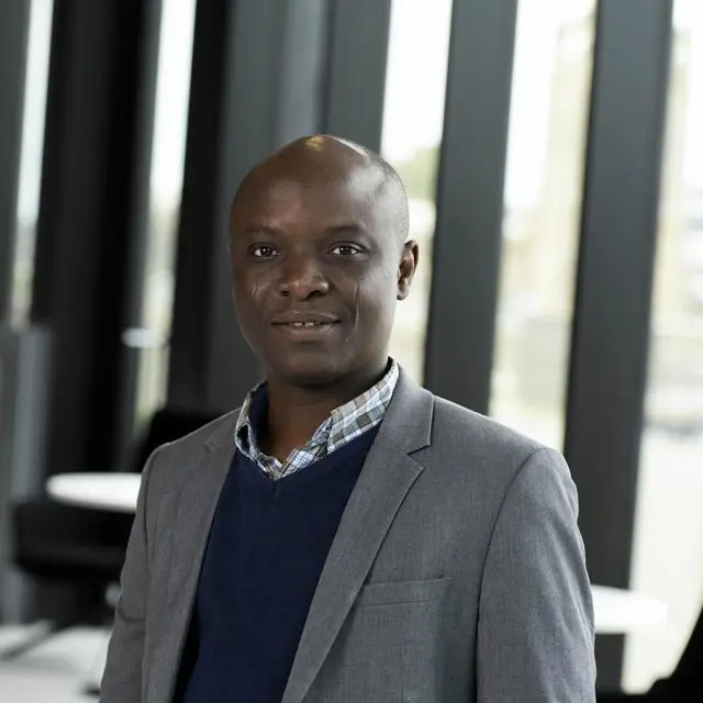 Headshot of Dr Akinola Adeniyi