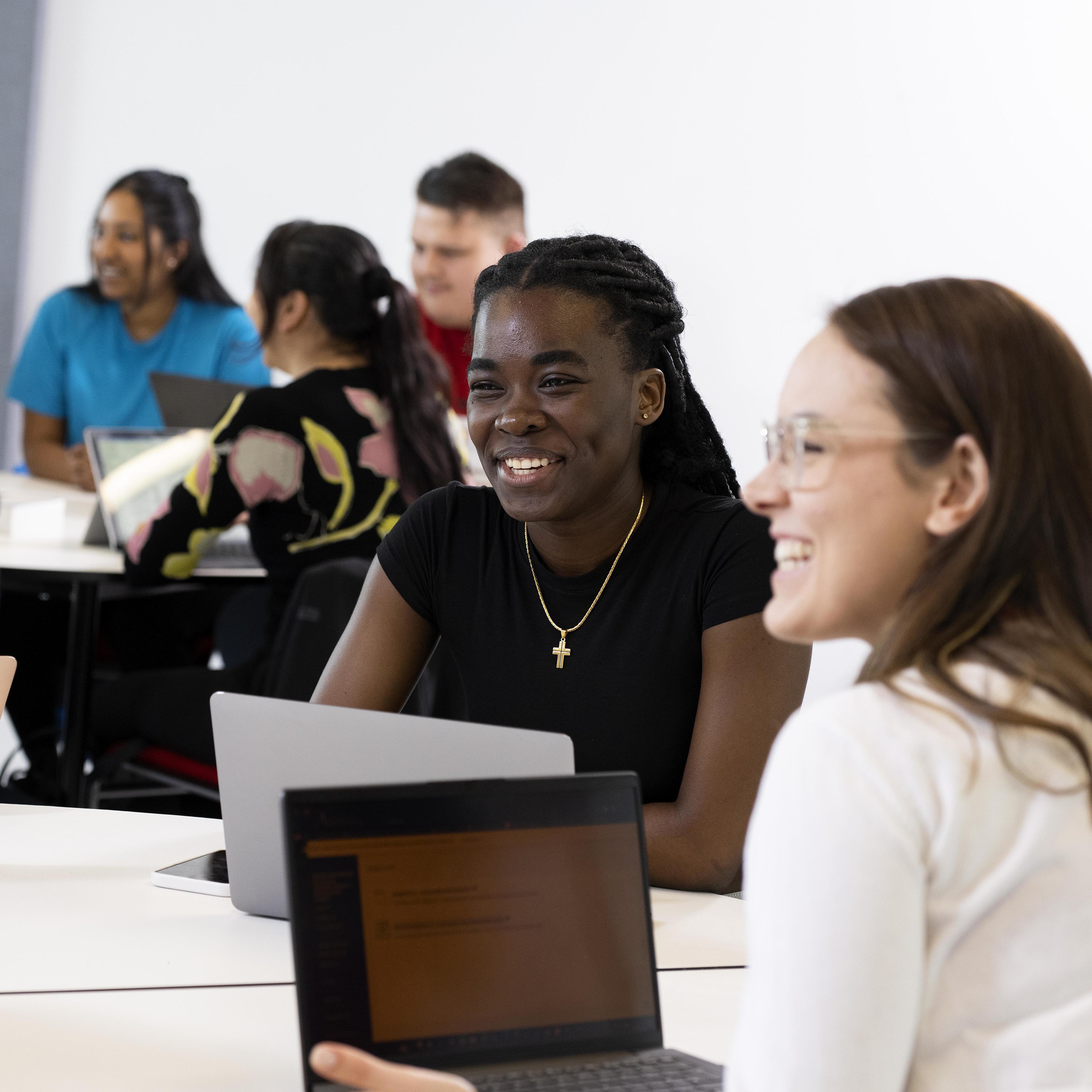 students in classroom chatting