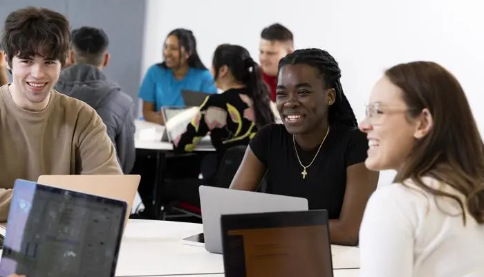 students in classroom chatting