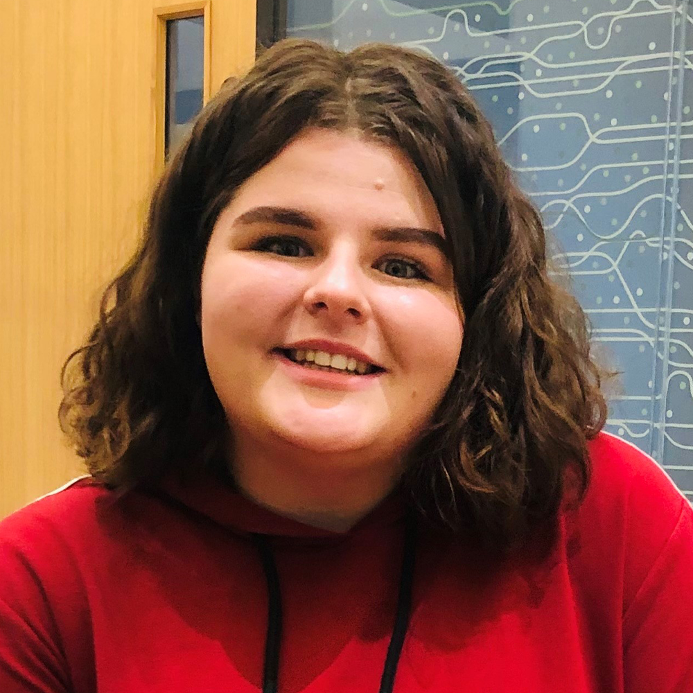 Headshot of Alice looking into the camera