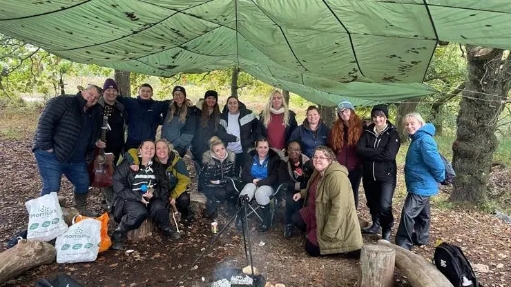 Students gathered around the campfire