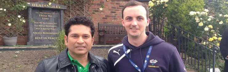 Graduate Treve Whitford pictured right, with cricket-legend Sachin Tendulkar