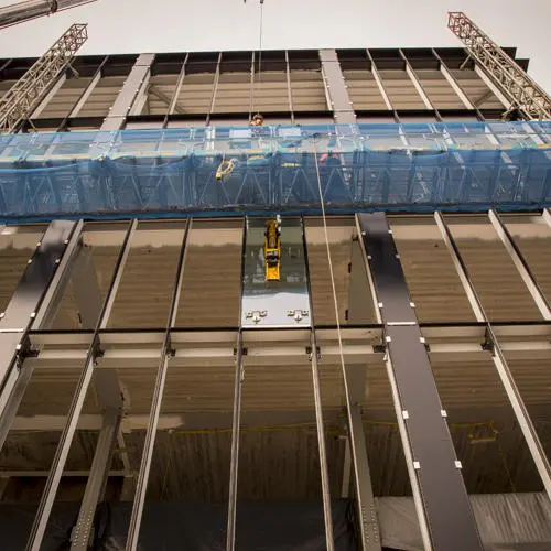 The first of over 600 glass panes has been installed
