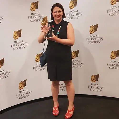 Kathe Paddison with her Postgraduate News award