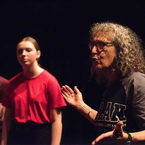 Risa Jaroslow working with the students