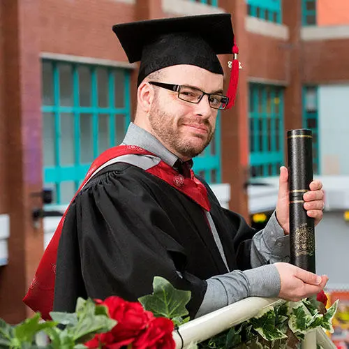 Michael collected his degree surrounded by family