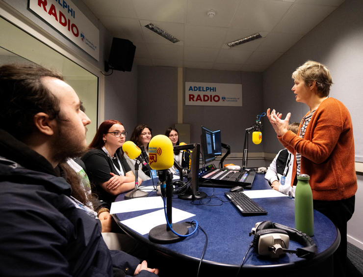 Caroline Hawtin, senior journalism lecturer, with Bolton 6th Form students in the radio studio