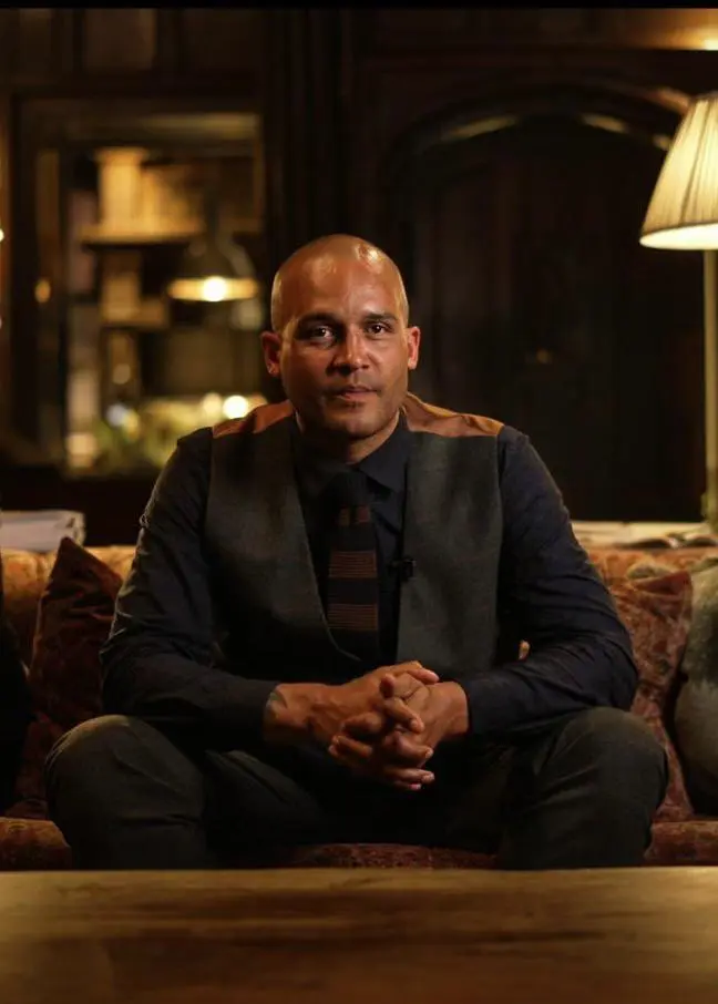 Clarke Carlisle sat down in a dark room