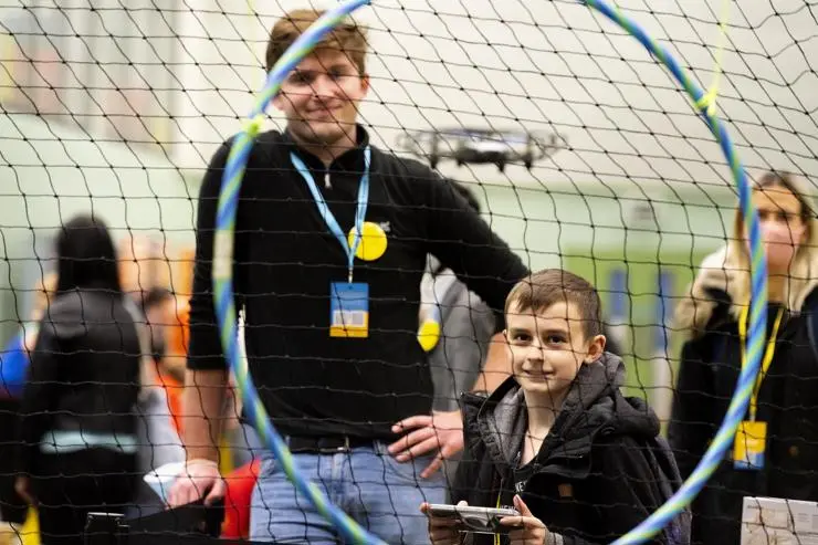Aerospace engineering student Conor Butcher-Doyle with Toby Cable flying a drone
