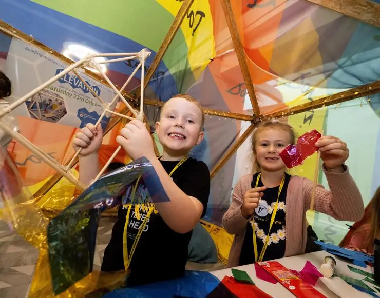 Eli Ealand and Amelia Rae building mini dens out of craft supplies
