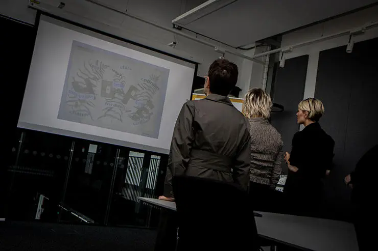Representatives from the University of Central Lancashire and the Harris Museum look at artwork submitted for the first Exhibition of Hope. 