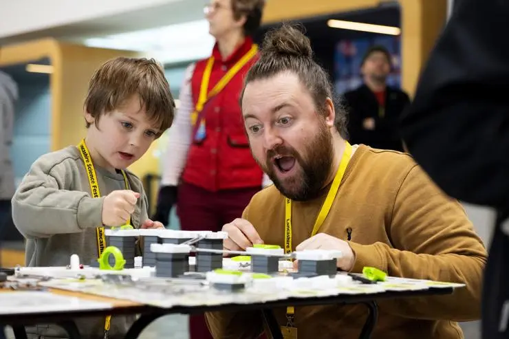 Harry and Neil Hutchinson getting hands-on with a physics puzzle