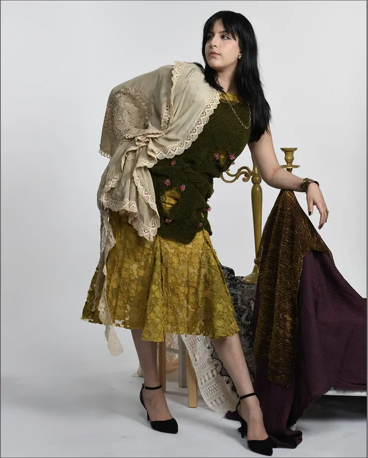 A short green knit dress on top of a midi godet dress designed by Noel.