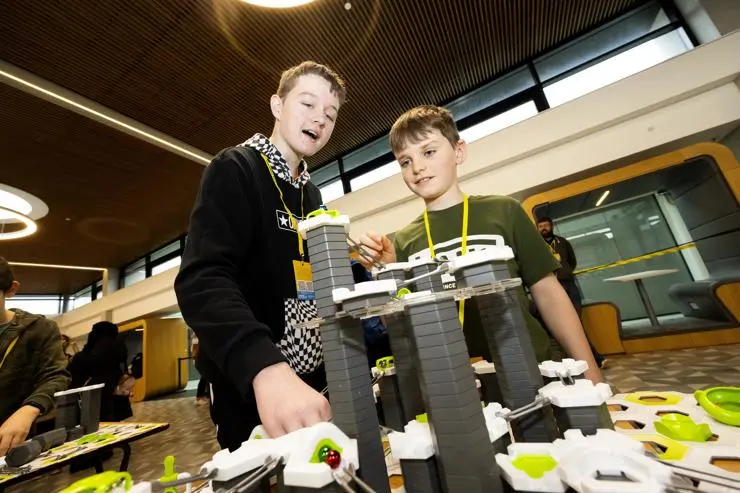 Sam Franklin and Solomon Evans getting hands-on in the Foster Science Showfloor