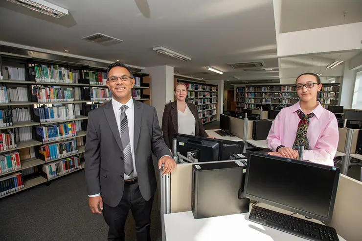 (L-R)  Pro-Vice Chancellor and Provost of UCLan's Burnley campus, Professor Ebrahim Adia, UCLan Burnley Campus strategic development lead Wendy Chester and UCLan Students’ Union President Zuleikha Chikh inside the library at Sandygate Mill.