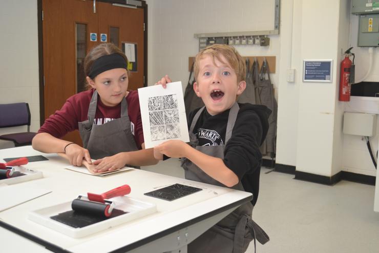 Charlotte and Finlay test out their lino printing skills