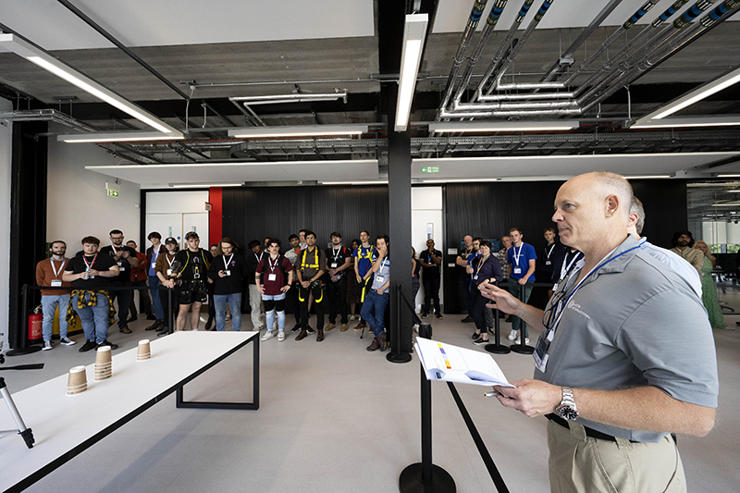 William Billotte, Director of Global Exo Technology Programs at ASTM International, speaks to participants before the competition starts.