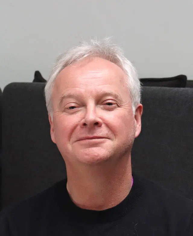 Headshot of Professor Chris Sutton