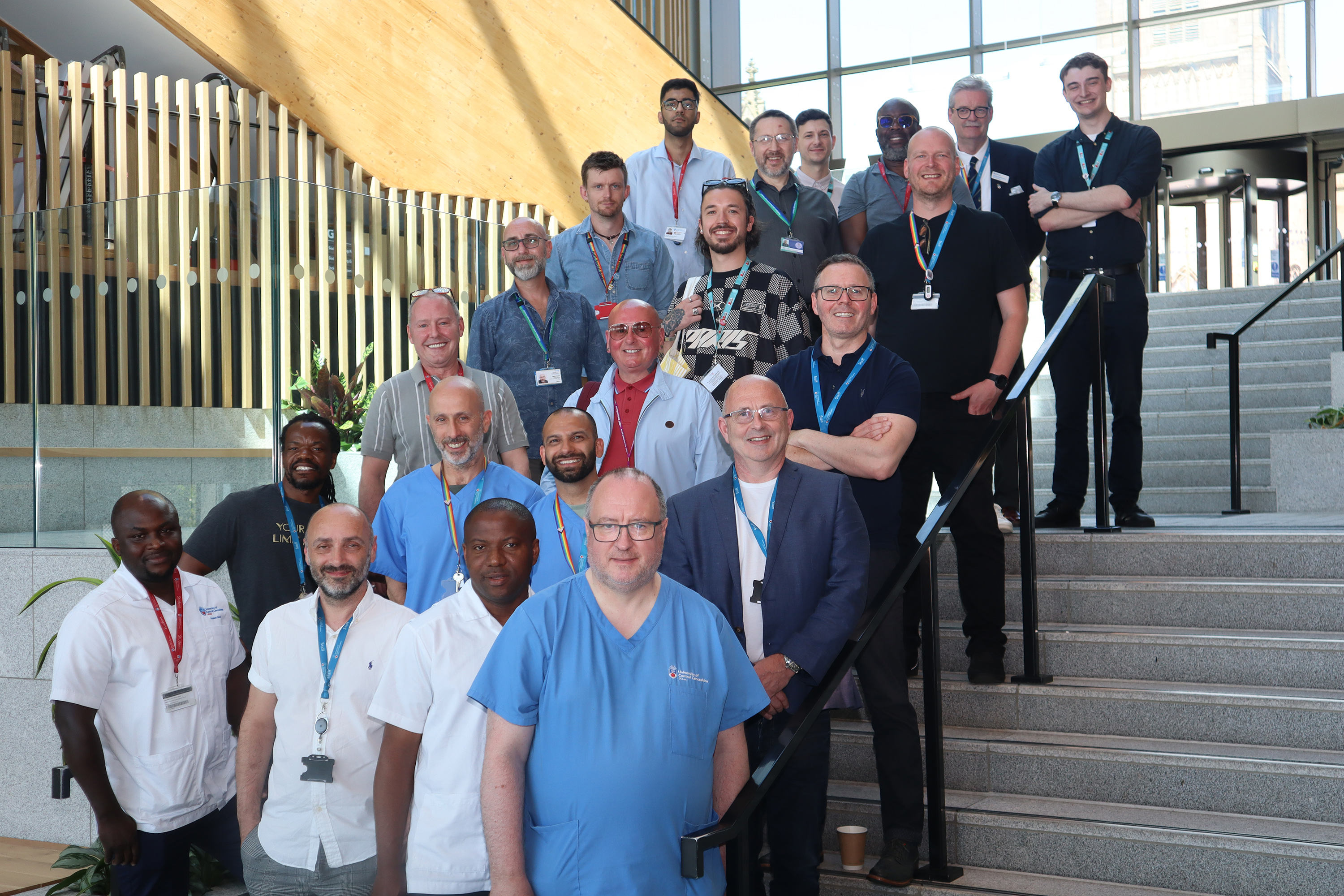 A group of men studying for, teaching, or working in health and care professions come together at the University of Central Lancashire to show their support for the #MenDoCare campaign.