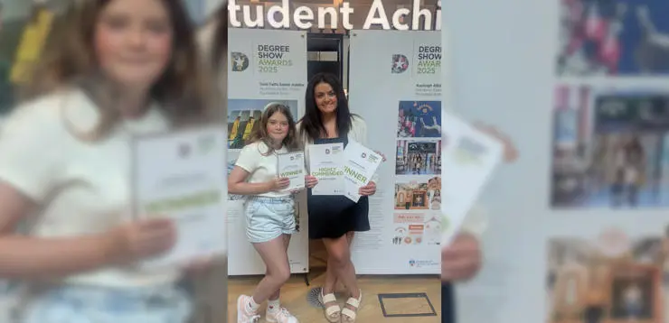Kayleigh with her daughter Emila at the University's Degree Show