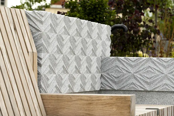 Close up of a planter seat with its decorative book end.