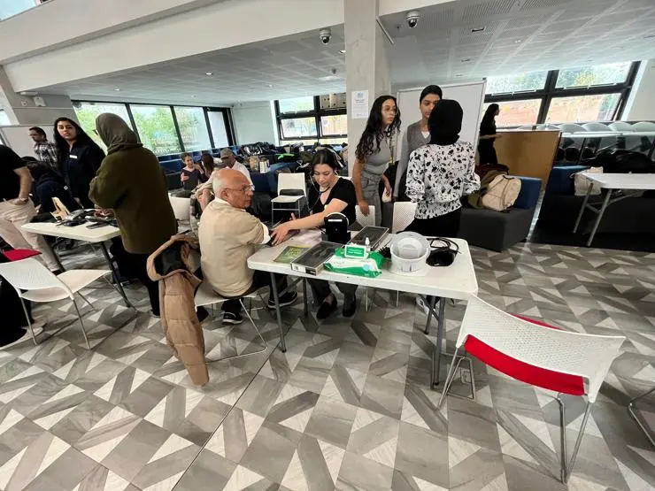 A man has a free blood pressure check
