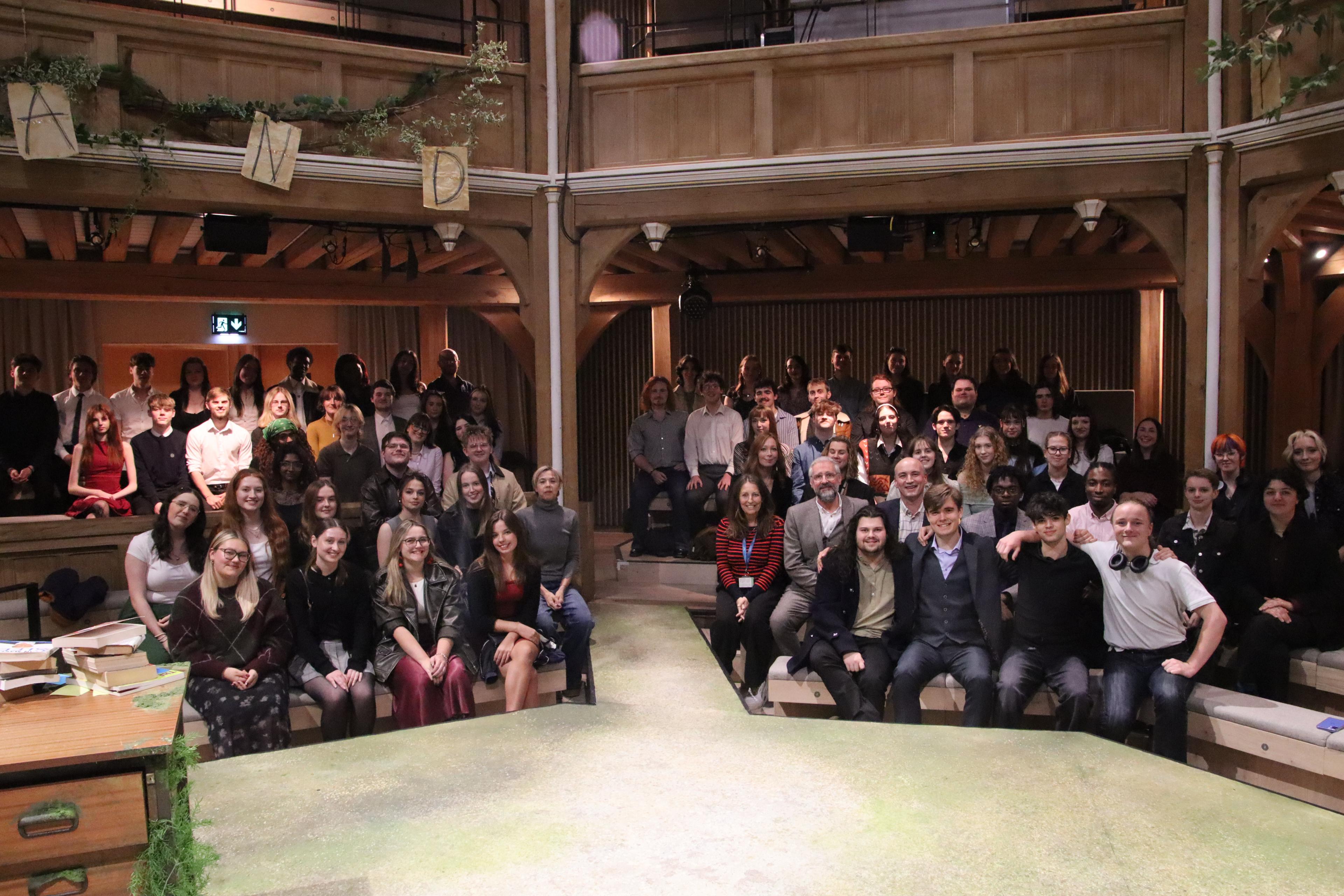 A group of students and staff sat in a theatre - credit Connie Evans
