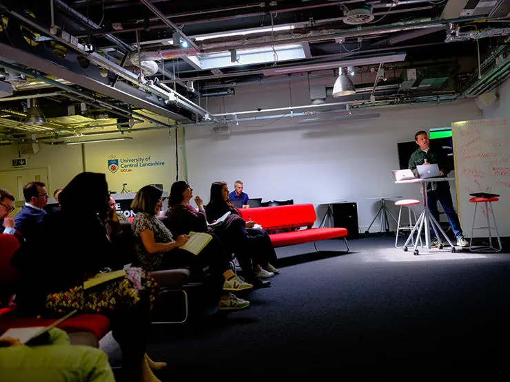 Matt Cooke, head of Google News Lab, speaks to participants