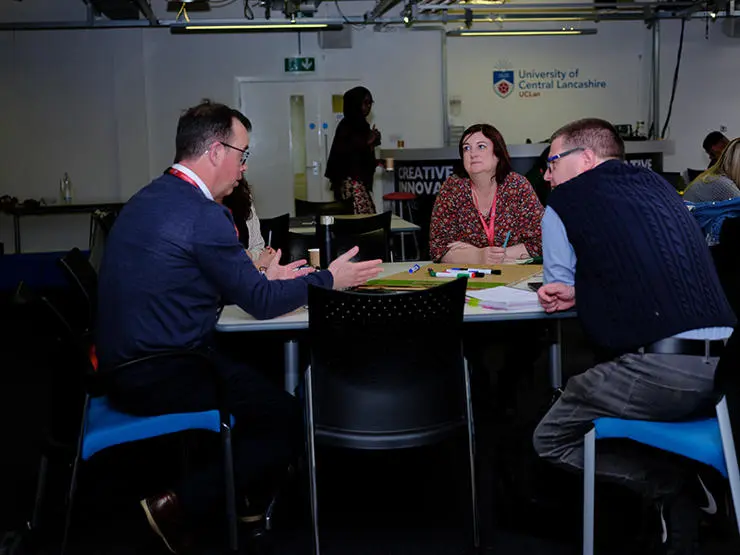 Participants in a round table discussion